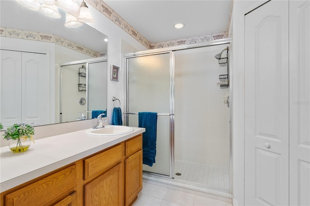 276 Gala Cir, Daytona Beach, FL 32124 - full bathroom featuring a shower stall, vanity, a closet, and tile patterned flooring