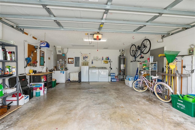 276 Gala Cir, Daytona Beach, FL 32124 - garage featuring washing machine and dryer, water heater, and a garage door opener