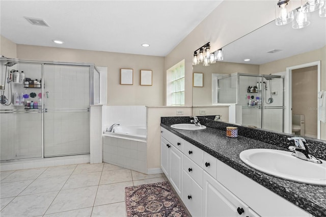 full bathroom featuring visible vents, a sink, a stall shower, and toilet