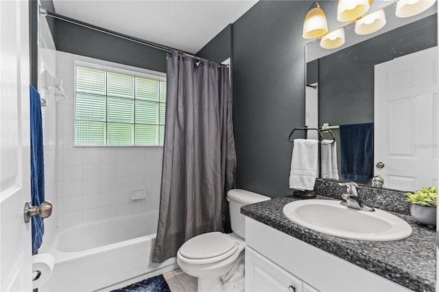 full bath featuring vanity, tile patterned floors, toilet, and shower / tub combo with curtain