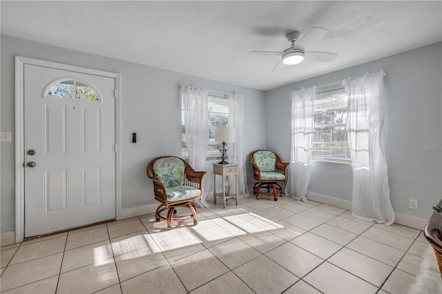 128 Oakridge Ave, Edgewater, FL 32132 - entrance foyer featuring plenty of natural light, baseboards, ceiling fan, and light tile patterned floors