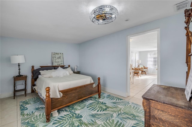 128 Oakridge Ave, Edgewater, FL 32132 - bedroom featuring light tile patterned flooring, baseboards, and visible vents