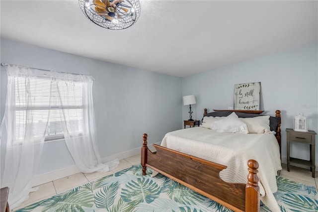 128 Oakridge Ave, Edgewater, FL 32132 - bedroom featuring baseboards and light tile patterned flooring