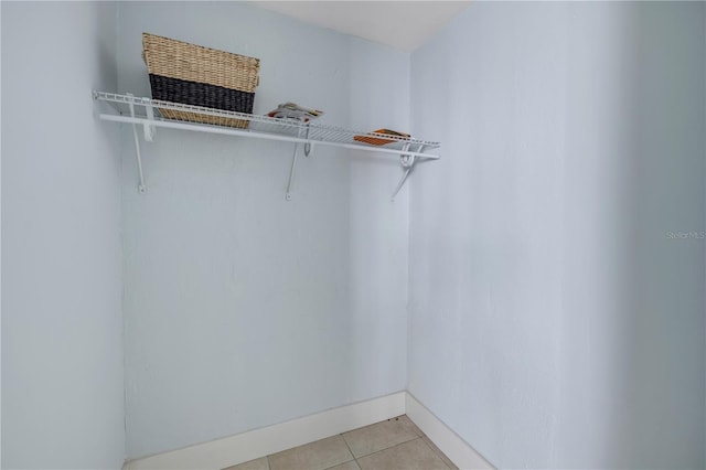 128 Oakridge Ave, Edgewater, FL 32132 - spacious closet with light tile patterned flooring