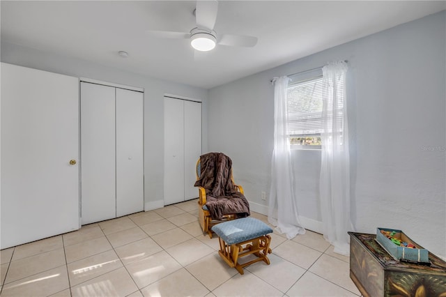 128 Oakridge Ave, Edgewater, FL 32132 - living area with light tile patterned floors and ceiling fan