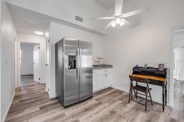 kitchen featuring visible vents, a ceiling fan, light wood finished floors, and stainless steel fridge with ice dispenser