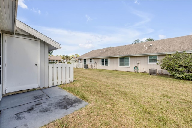 exterior space featuring a patio, fence, and central AC unit