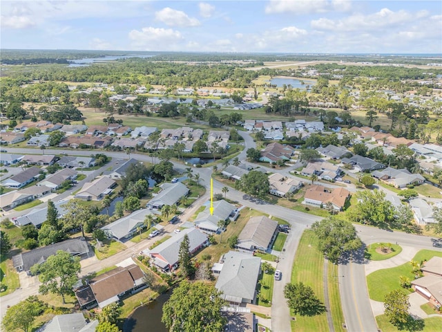 birds eye view of property featuring a residential view and a water view
