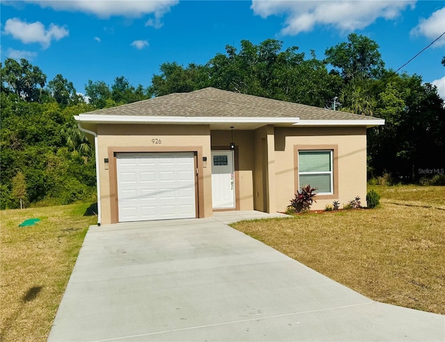 926 Clover St, Deland, FL 32720 - view of front of home with a garage, stucco siding, driveway, and a front lawn