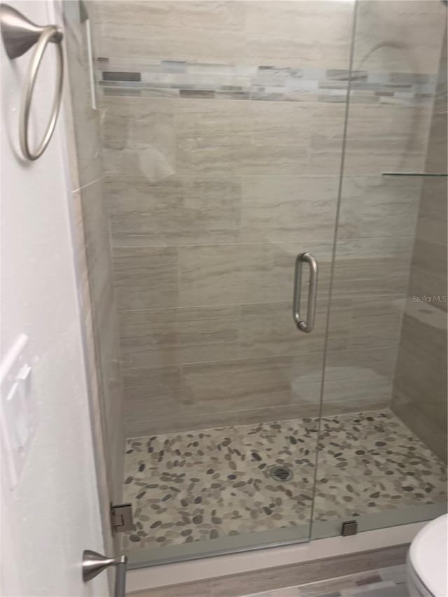 926 Clover St, Deland, FL 32720 - bathroom featuring a stall shower and toilet