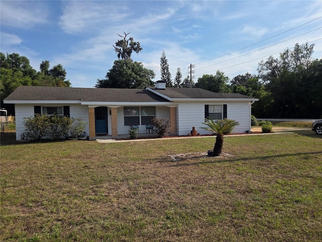 ranch-style home with a front lawn