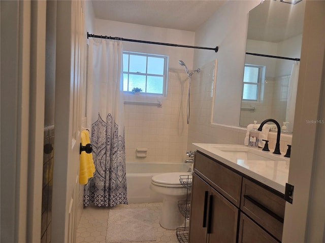 bathroom featuring vanity, shower / tub combo with curtain, tile patterned floors, and a healthy amount of sunlight