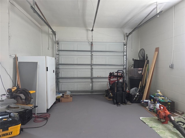 garage with concrete block wall