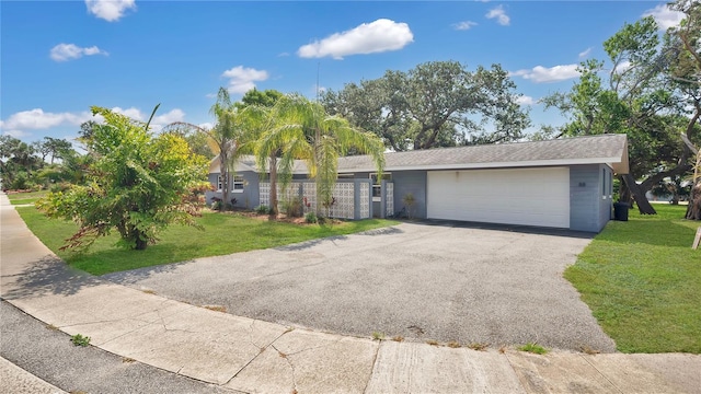 88 Valencia Dr, Ormond Beach, FL 32176 - view of front of house featuring a front yard, a garage, and driveway