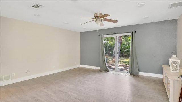 88 Valencia Dr, Ormond Beach, FL 32176 - spare room with a ceiling fan, light wood-style flooring, and baseboards