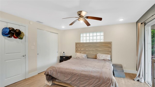 88 Valencia Dr, Ormond Beach, FL 32176 - bedroom with light wood-type flooring, multiple windows, baseboards, a ceiling fan, and recessed lighting