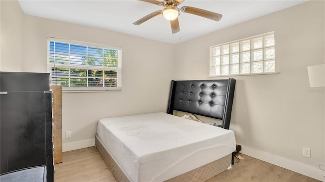 88 Valencia Dr, Ormond Beach, FL 32176 - bedroom featuring wood finished floors, baseboards, and ceiling fan