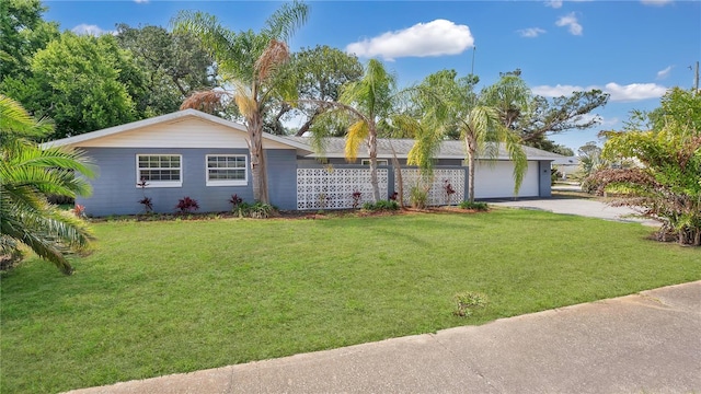 88 Valencia Dr, Ormond Beach, FL 32176 - view of front of house featuring driveway, a front lawn, and a garage