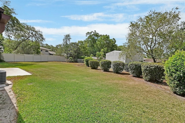 view of yard featuring fence and a patio area