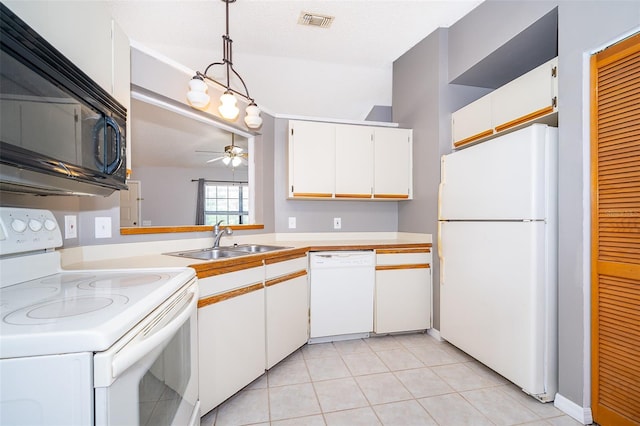 3107 Mapleshade St, Deltona, FL 32738 - kitchen with white appliances, a sink, ceiling fan, light countertops, and white cabinets