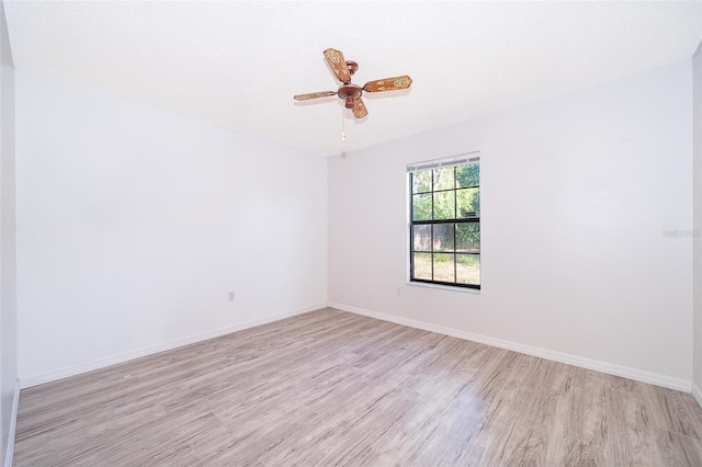 3107 Mapleshade St, Deltona, FL 32738 - spare room featuring light wood-type flooring, baseboards, and ceiling fan