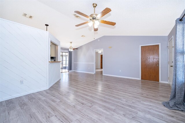 3107 Mapleshade St, Deltona, FL 32738 - unfurnished living room featuring lofted ceiling, ceiling fan, light wood finished floors, and baseboards