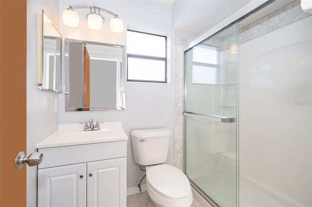 3107 Mapleshade St, Deltona, FL 32738 - bathroom featuring toilet, a shower stall, vanity, and baseboards