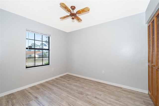 3107 Mapleshade St, Deltona, FL 32738 - unfurnished bedroom with a closet, light wood-type flooring, baseboards, and a ceiling fan