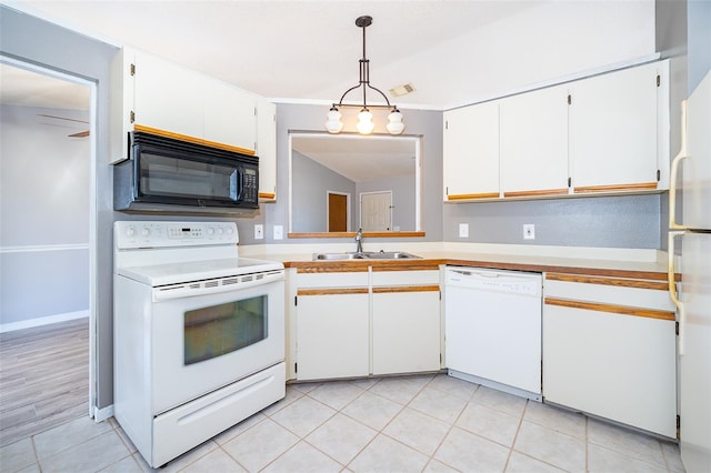 3107 Mapleshade St, Deltona, FL 32738 - kitchen with white appliances, a sink, light countertops, white cabinetry, and pendant lighting
