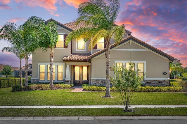 163 Rosa Bella Vw, Debary, FL 32713 - exterior space with french doors, a tiled roof, stucco siding, and stone siding