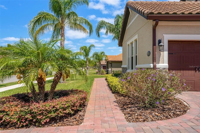 163 Rosa Bella Vw, Debary, FL 32713 - exterior space with a tiled roof and stucco siding