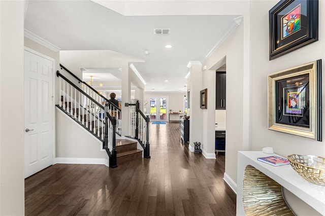 163 Rosa Bella Vw, Debary, FL 32713 - foyer entrance featuring baseboards, ornamental molding, wood finished floors, and visible vents