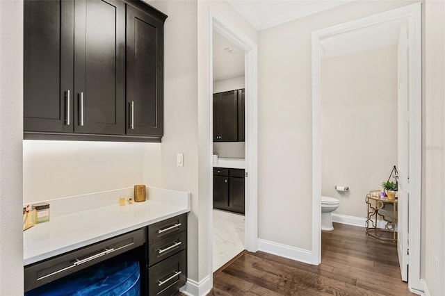 163 Rosa Bella Vw, Debary, FL 32713 - bathroom with vanity, baseboards, wood finished floors, and toilet