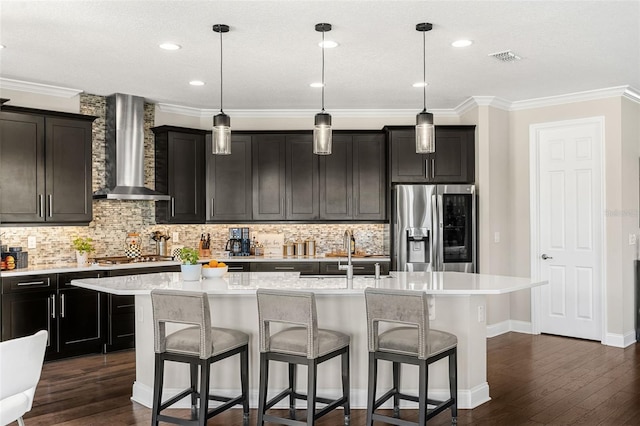 163 Rosa Bella Vw, Debary, FL 32713 - kitchen featuring a sink, stainless steel fridge with ice dispenser, wall chimney exhaust hood, a center island with sink, and dark wood-style floors