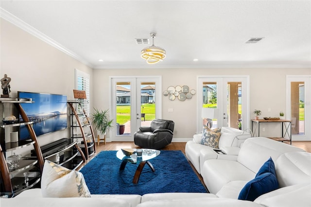 163 Rosa Bella Vw, Debary, FL 32713 - living area featuring crown molding, visible vents, french doors, and wood finished floors