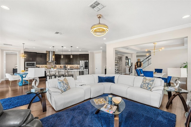 163 Rosa Bella Vw, Debary, FL 32713 - living room featuring a chandelier, recessed lighting, wood finished floors, and visible vents