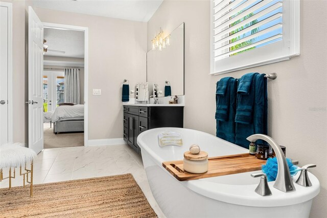 163 Rosa Bella Vw, Debary, FL 32713 - ensuite bathroom featuring ensuite bath, a freestanding bath, a wealth of natural light, and vanity