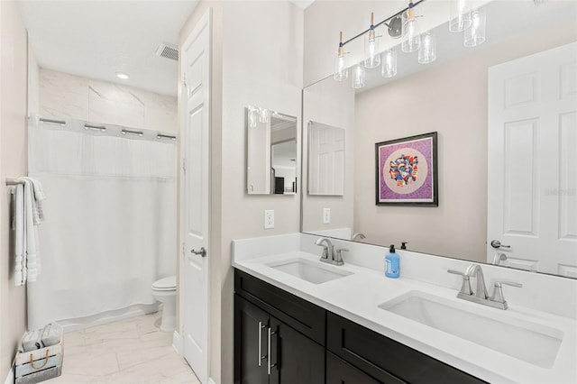 163 Rosa Bella Vw, Debary, FL 32713 - bathroom with double vanity, toilet, a sink, and marble finish floor