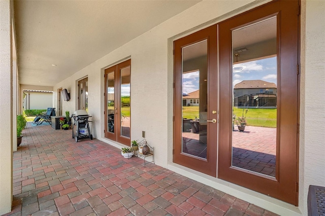 163 Rosa Bella Vw, Debary, FL 32713 - view of patio featuring french doors and a grill