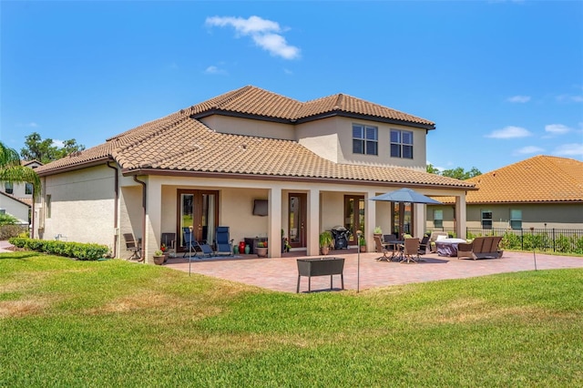 163 Rosa Bella Vw, Debary, FL 32713 - rear view of property featuring a patio, stucco siding, a yard, and a tiled roof
