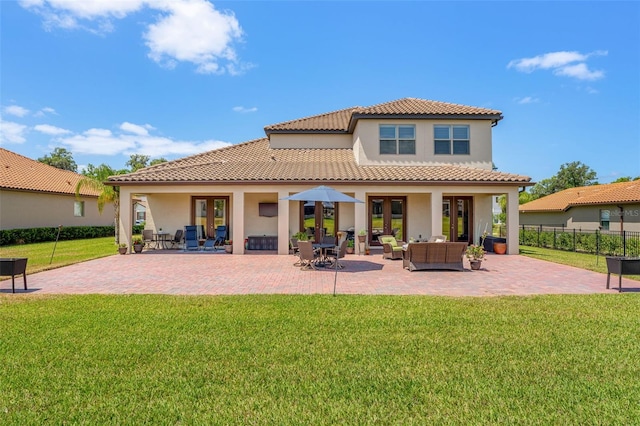 163 Rosa Bella Vw, Debary, FL 32713 - rear view of property with a tiled roof, fence, an outdoor hangout area, a patio, and stucco siding