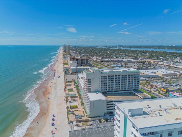 drone / aerial view featuring a view of the beach and a water view