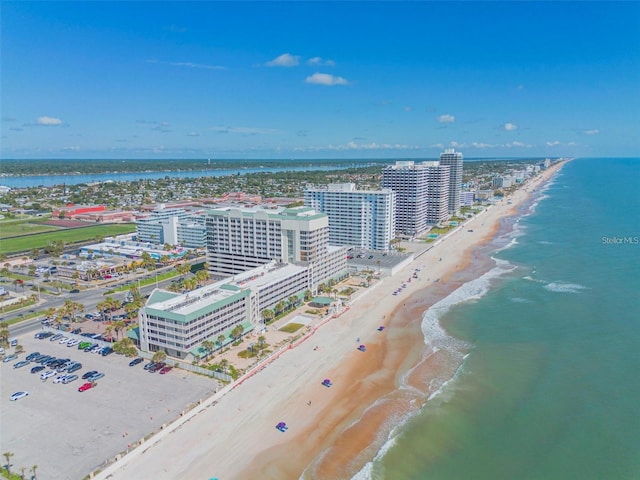drone / aerial view with a beach view and a water view