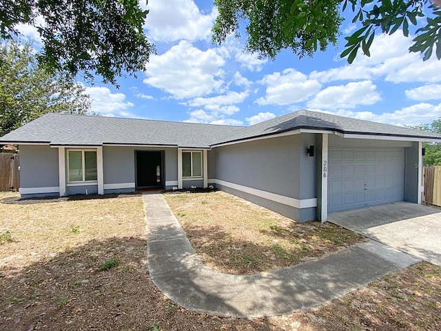 206 Westmoor Bnd, Orlando, FL 32835 - single story home with fence, an attached garage, concrete driveway, and stucco siding