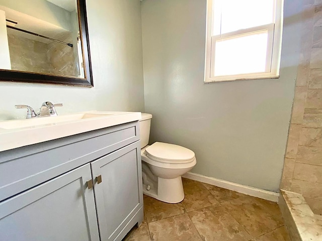 206 Westmoor Bnd, Orlando, FL 32835 - full bath featuring a tile shower, vanity, toilet, tile patterned floors, and baseboards