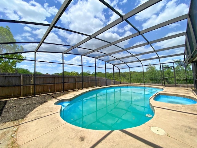 206 Westmoor Bnd, Orlando, FL 32835 - view of pool featuring a fenced backyard, glass enclosure, a patio area, and a pool with connected hot tub
