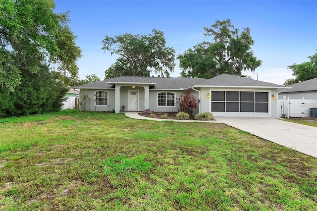 1715 Queen Palm Dr, Edgewater, FL 32132 - ranch-style house featuring concrete driveway, a garage, and stucco siding