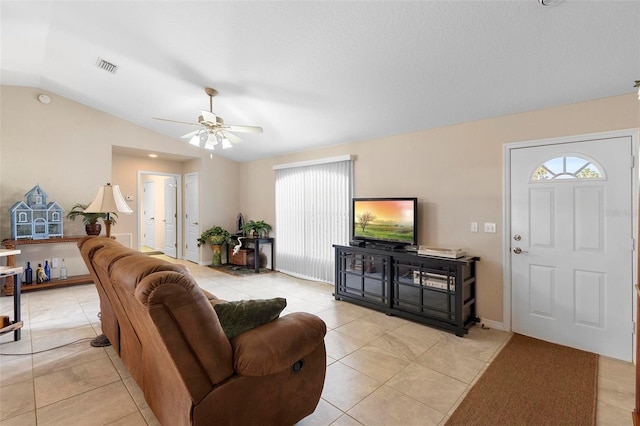 1715 Queen Palm Dr, Edgewater, FL 32132 - living room featuring vaulted ceiling, ceiling fan, and light tile patterned flooring