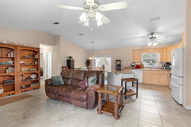 1715 Queen Palm Dr, Edgewater, FL 32132 - living area featuring a ceiling fan, light tile patterned floors, and lofted ceiling