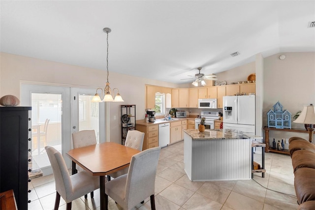 1715 Queen Palm Dr, Edgewater, FL 32132 - kitchen featuring white appliances, light brown cabinetry, vaulted ceiling, a center island, and a ceiling fan